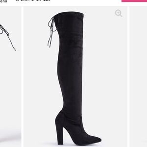 Knee high black heeled boots